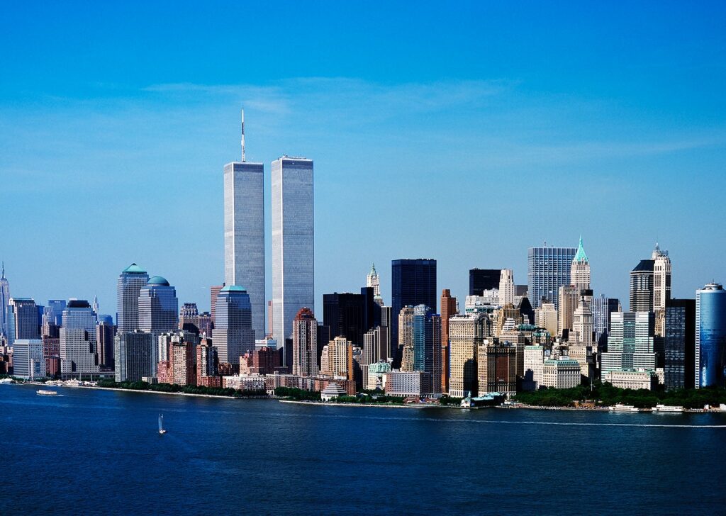 Aerial view of New York City, in which the World Trade Center Twin Towers is prominent.